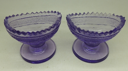 A pair of Georgian cut glass, lilac coloured salts,