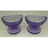 A pair of Georgian cut glass, lilac coloured salts,