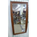 A teak framed mirror