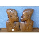 A pair of African carved wood busts