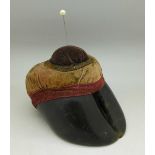 A cow's hoof pin cushion