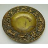 A bronze Zodiac dish, diameter 14.