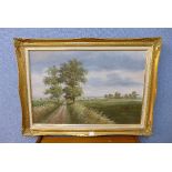 A country landscape, oil on board, indistinctly signed,