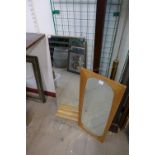 A teak framed mirror and another mirror