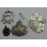 Three silver pendants,