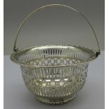 A silver basket with handle,