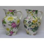 A pair of Wayman Ceramics Bloomers floral decorated jugs