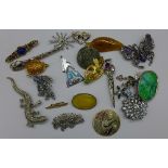 Twenty costume brooches including Celtic and amber