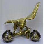 A brass model eagle and a pair of metal vases