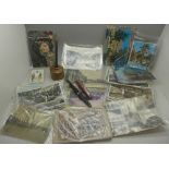 A collection of postcards, a pen and a stoneware inkwell, miniature Bible, etc.