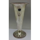 An 830 silver vase with enamel badge, bears inscription,