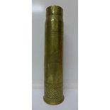 A brass trench art shell case vase decorated with geometric pattern, flowers, trees, dragon,