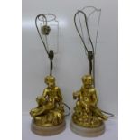 A pair of gilt figural table lamp bases