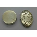 A silver pill box and a locket,