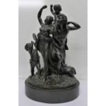 A 19th Century bronze figure group, after Claude Michel and signed Clodion, on an oval marble base,