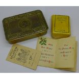 A WWI Princess Mary 1914 Christmas tin with original packet of cigarettes and card