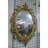 A Rococo style gilt framed mirror