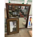 A pair of oak framed prints and a mirror