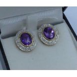 An pair of 18ct gold, amethyst and diamond cluster earrings for pierced ears, 7g, 14.