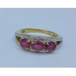 A silver gilt, ruby and diamond ring,