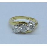 An 18ct gold, three stone diamond ring, diamond weight stamped on shank 1carat, 4.