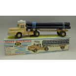 A Dinky Supertoys 893 Sahara Tractor with pipe carrier, (French version),