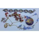 An enamel bracelet and a matching brooch,