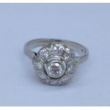 A 14ct gold, nine stone diamond cluster ring, over 1carat diamond weight, 3.