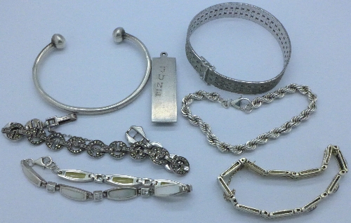 Five silver bracelets, a silver bangle and a silver ingot pendant, ingot a/f,