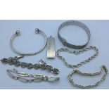 Five silver bracelets, a silver bangle and a silver ingot pendant, ingot a/f,