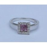 A 9ct white gold, diamond and pink stone ring, 3.