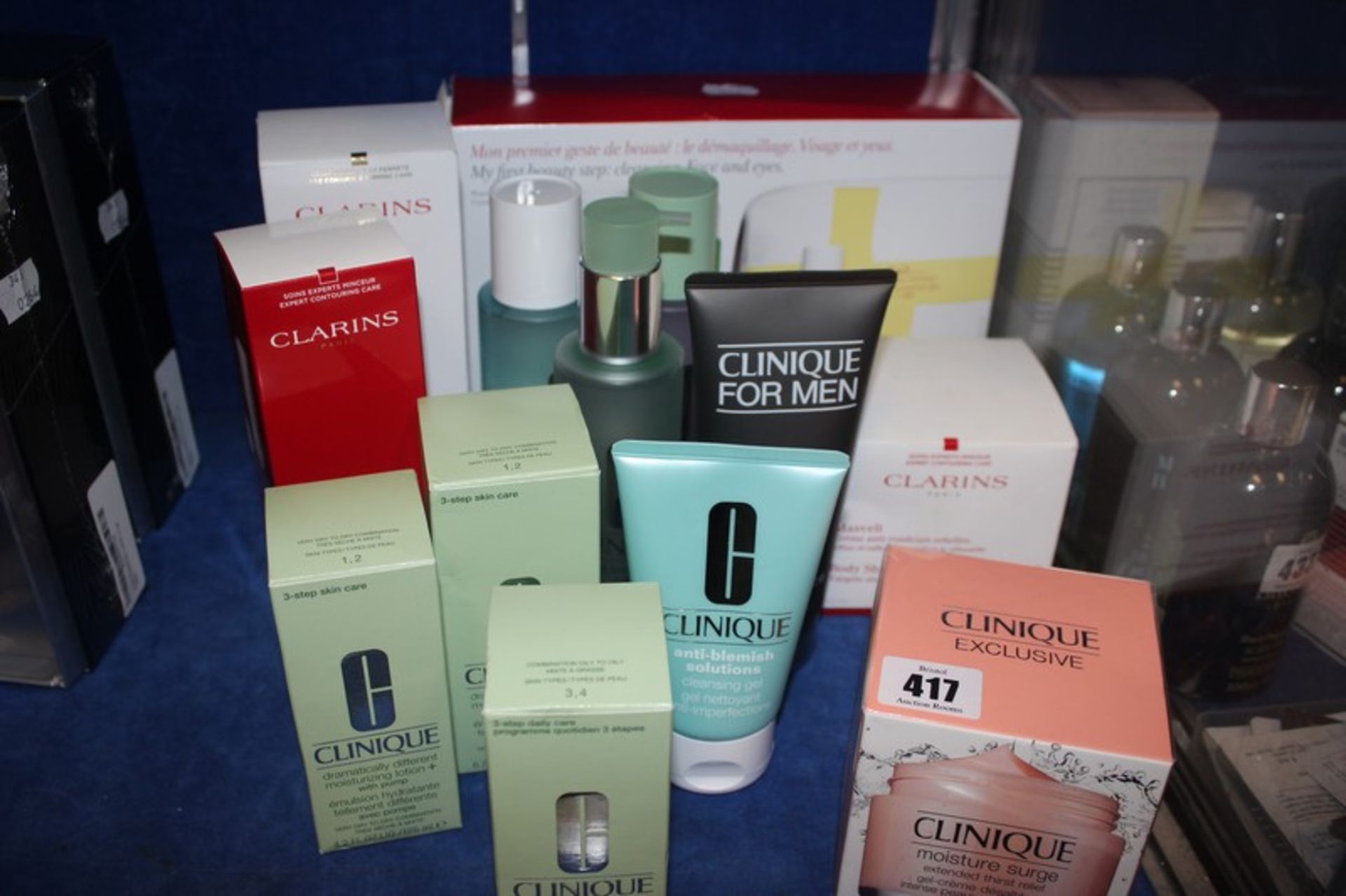 Assorted as new Clarins and Clinique skin care products including gift set, body lift, body