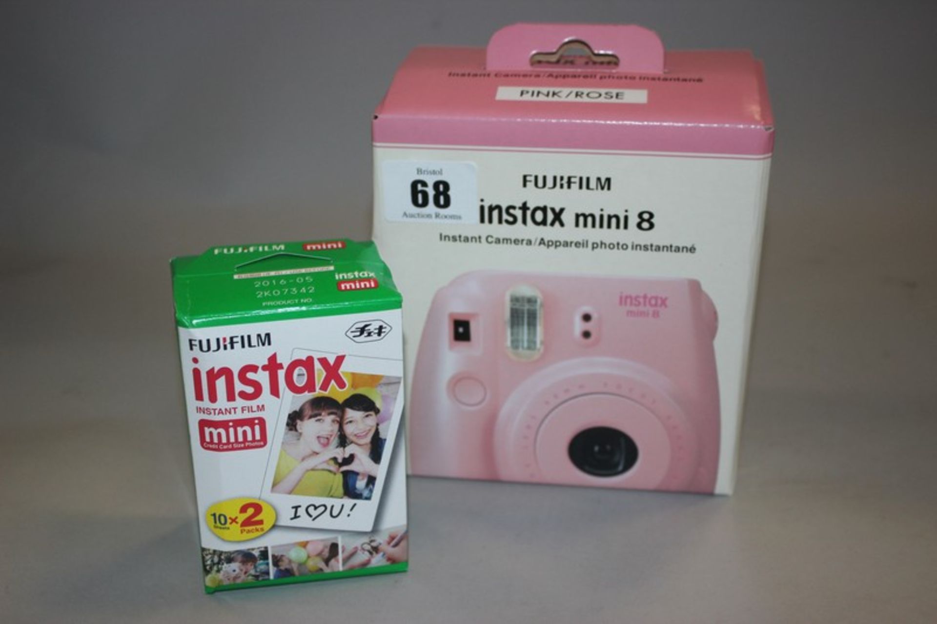A pink/rose Fujifilm Instax mini 8 instant camera with 20 shots (Boxed as new).