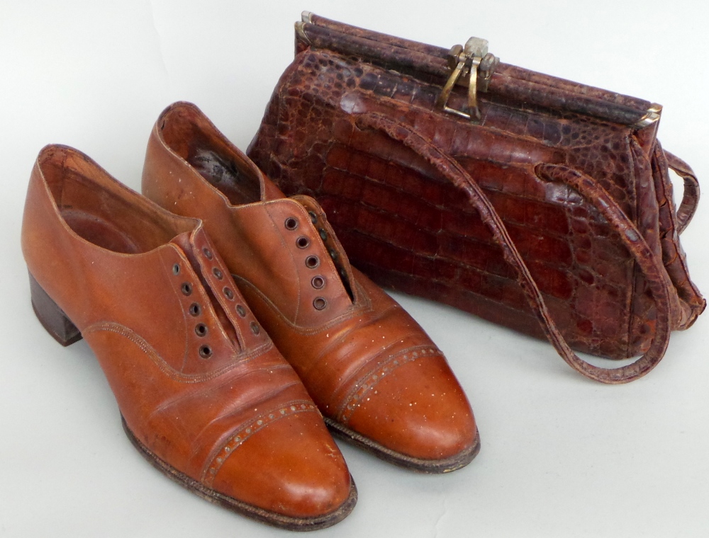 A pair of hand finished vintage tan leather brogue style walking shoes approx size 5.