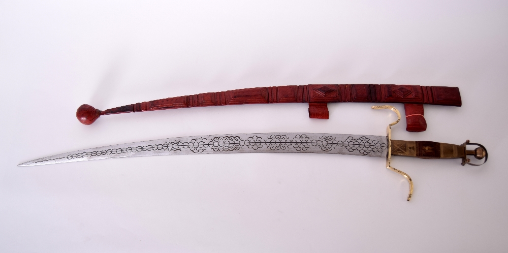 An early 20th century Tuareg/Berber curved sword and thick leather scabbard with traditional - Image 3 of 3