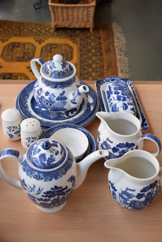 A quantity of Churchill blue and white willow tree pattern ceramics including tea pot, coffee pot,
