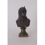 A 19th century orientalist bronze bust of an Egyptian Queen with an ibis headress facing to