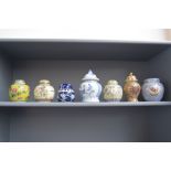 A collection of ginger jars and covers including various oriental style jar namely a blue and white