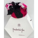 Sunning cerise pink Frederick Fox cocktail hat with pink and black feathers and black bow.