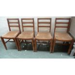 A set of four 20th century oak bar back dining chairs with beige drop in seats together with a