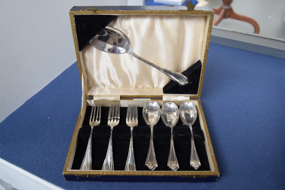 A cased set of Art Deco silver plated forks and spoons, retailed by W.