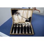 A cased set of Art Deco silver plated forks and spoons, retailed by W.