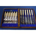 A set of Art Deco silver plated fish knife and forks with resin handles, with silver collars,