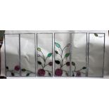 A set of six leaded glass panels, forming an Art Nouveau design of flowering roses,