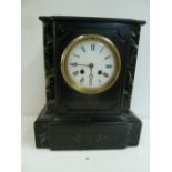 A late 19th/early 20th century black slate and marble mantle clock, enamel dial with Roman numerals,