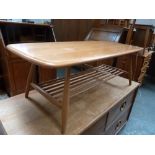 An Ercol light elm coffee table with under shelf,