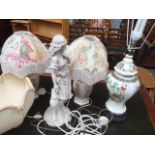 A pair of Oriental style lamp bases, with one other Chinese style lamp base on wooden base,