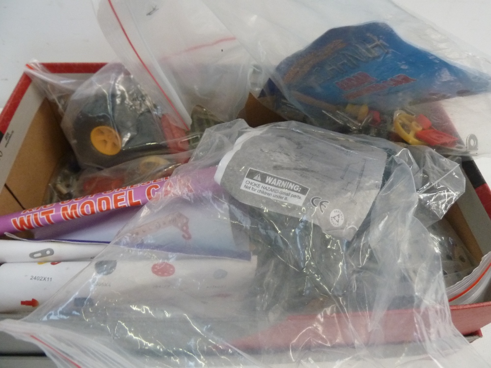 A box of "Meccano" style car kits