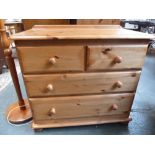 A modern pine chest of drawers,