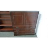 A modern mahogany television cupboard with drawer below